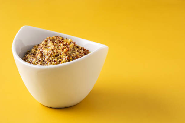 istock Mustard sauce in white bowl 1323007014