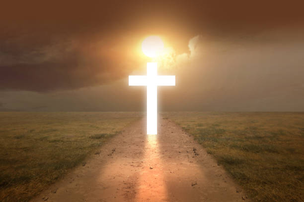 istock Christian cross on the dirty road 1323007407