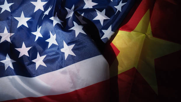 USA and China flag on black background. Represent serious trade tension or trade war between America and China. financial concept. Flags of China and the United States of America on Black. top view angle. bandera de ee.uu. y china sobre fondo negro. representan una grave tensión comercial o una guerra comercial entre estados unidos y china. concepto financiero. banderas de china y los estados unidos de américa en negro. ángulo de visión superior.