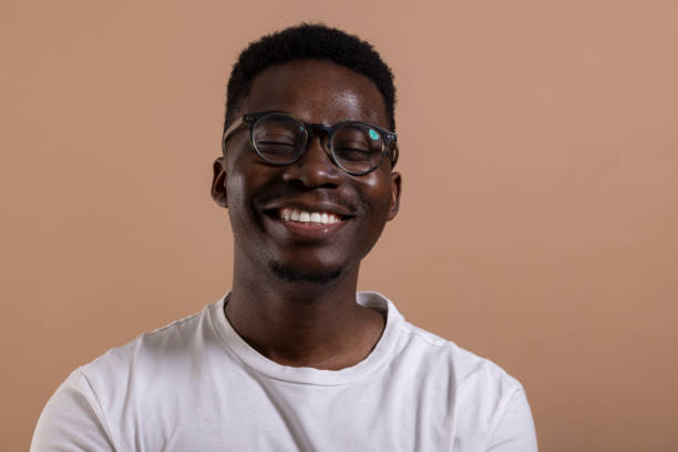 istock Happy African American man posing in a photo studio 1323013509
