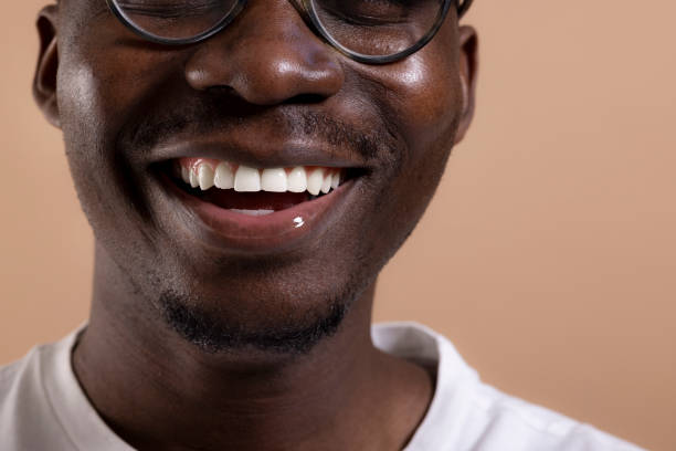 istock Happy African American man posing in a photo studio 1323013611