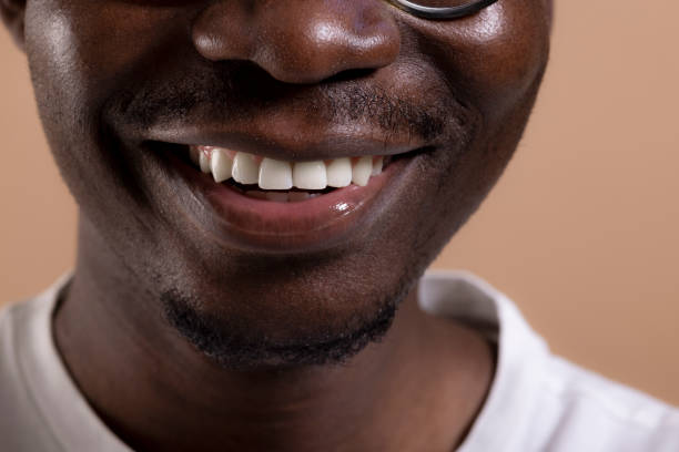 istock Happy African American man posing in a photo studio 1323013648