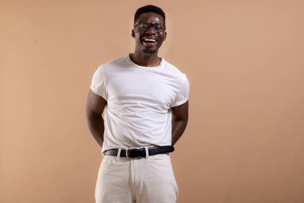 istock Happy African American man posing in a photo studio 1323013708