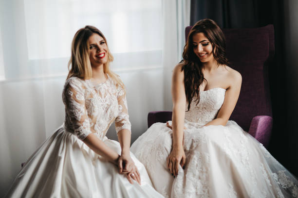 istock Two beautiful young women in wedding dresses 1323013941
