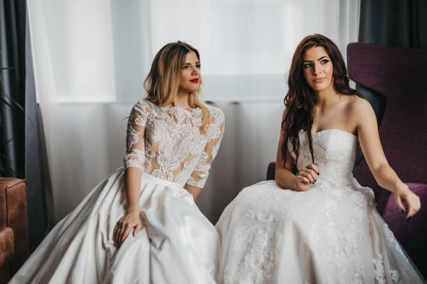 istock Two beautiful young women in wedding dresses 1323013973