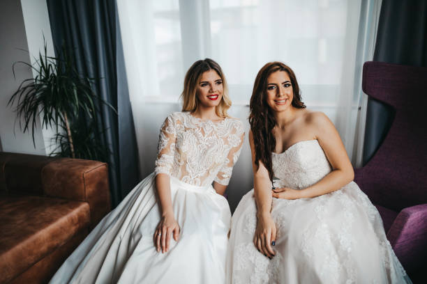 istock Two beautiful young women in wedding dresses 1323013976