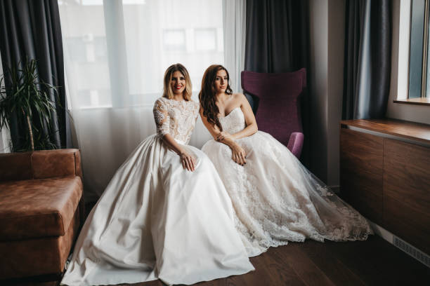 istock Two beautiful young women in wedding dresses 1323013989