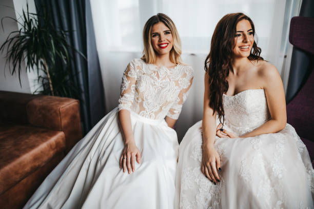 istock Two beautiful young women in wedding dresses 1323013995