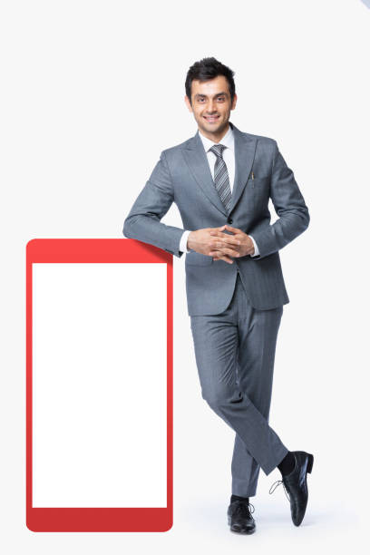молодой бизнесмен с мобильной доской объявлений:- стоковое фото - bulletin board office blank vertical стоковые фото и изображения