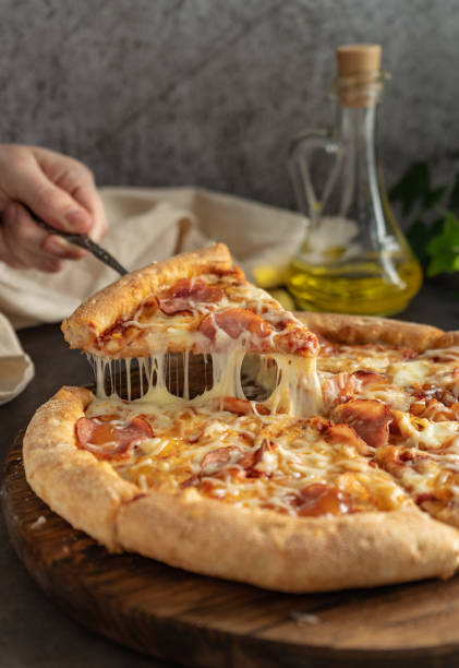 istock selective focus. hot pizza with cheese and pepperoni 1323017200