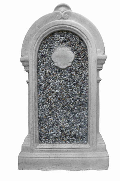 istock Decorated, oval granite tombstone filled with small pebbles, on white background, cut out 1323017477