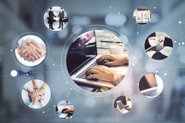 istock Online working process concept with hands typing on laptop keyboard surrounded by businessmen handshaking, coffee cup, notebook, smartphone in hand and teamwork. 1323019877