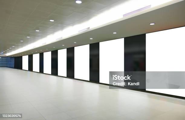 Multiple Vertical Blank White Panels Of Advertising Billboard Poster Templates In A Long Tunnel Walkway Outofhome Ooh Media Display Space Mockup In Pedestrian Linkway Digital Display Stock Photo - Download Image Now