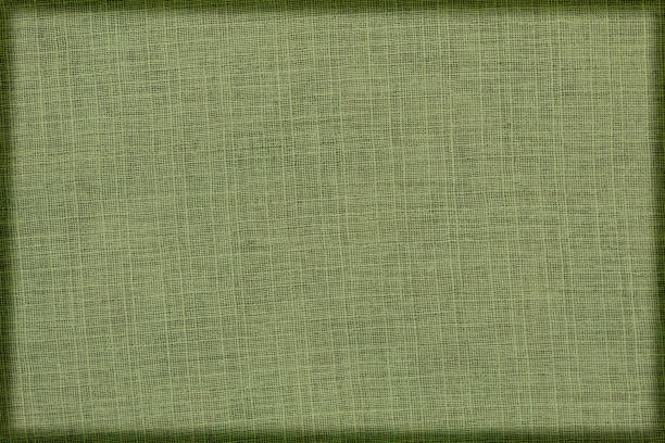 istock Linen green fabric in a dark green frame. 1323021271