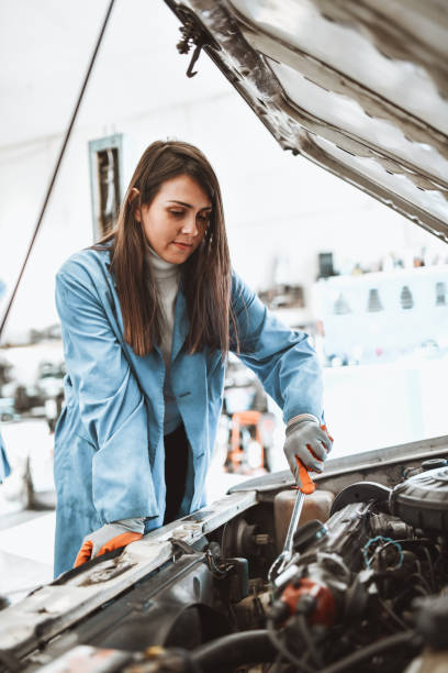 istock Cute Female Mechanic Happy With Car Engine Maintenance Procedure 1323021951