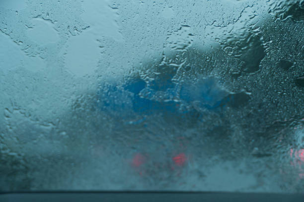 車の雨天のフロントガラス - water inside of motion abstract ストックフォトと画像
