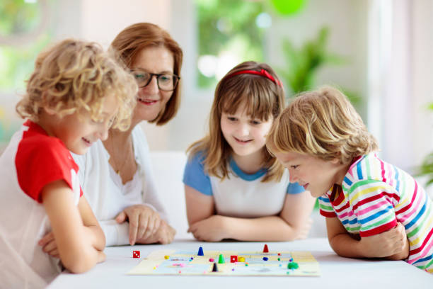 istock Family playing board game. Kids play. 1323028876