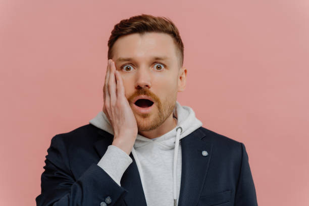 istock Impressed guy getting some awesome news and being in shock 1323029056