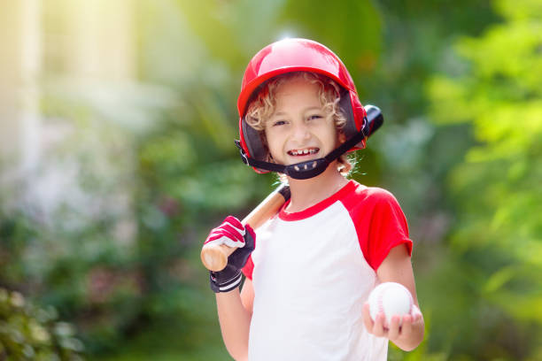 istock Kids play baseball. Child with bat and ball. 1323030062