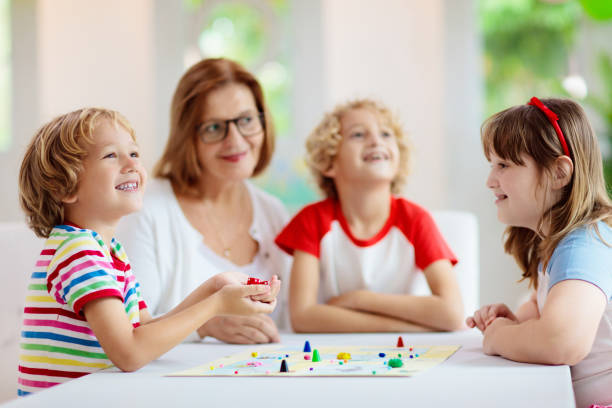 istock Family playing board game. Kids play. 1323030115