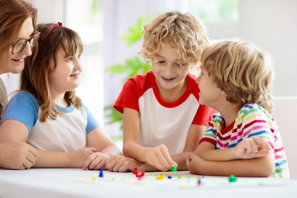 istock Family playing board game. Kids play. 1323030511