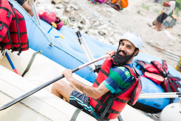 istock young men ready for rafting:- stock photo 1323030570
