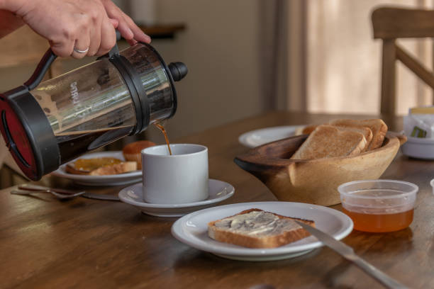 istock woman serving cup of hot coffee 1323031436