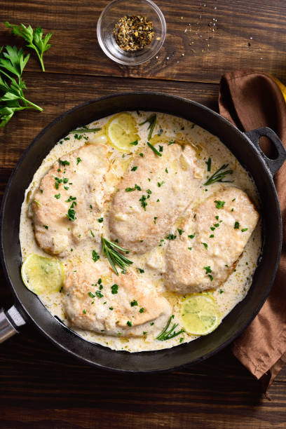 istock Chicken breast in creamy garlic sauce 1323031553
