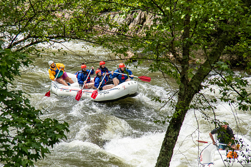 May 28, 2021 - Ocoee River, Georgia, U.S.: A group of people river rafting the rapids of the Ocoee River.