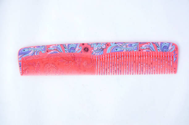 istock the beautiful pink color comb isolated on white background. 1323032328