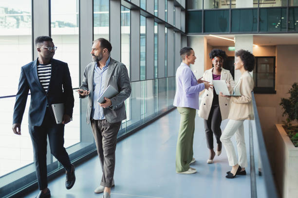 istock Diverse Businesspeople Talking in the Office Corridor 1323032720