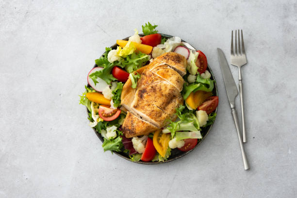 istock Chicken breast baked with salad 1323033046