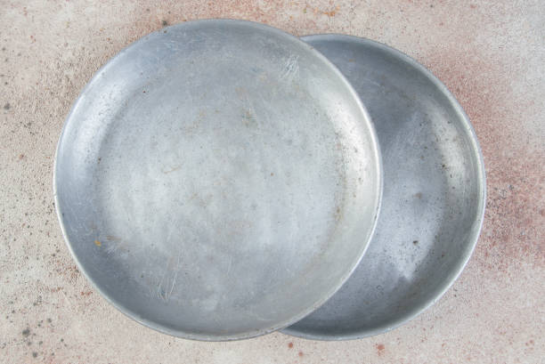 Old metal plates for scales on concrete background. Copy space for text.