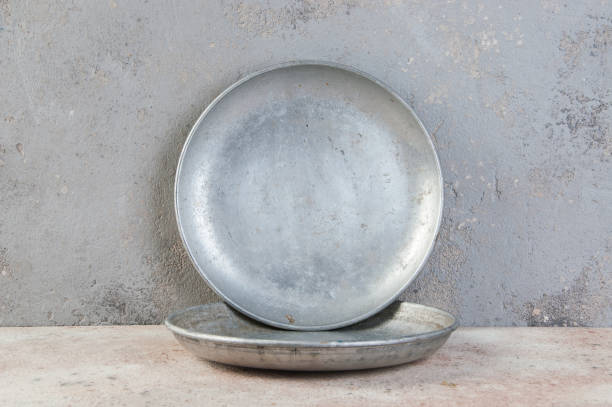 istock Old metal plates for scales on concrete background. 1323036571
