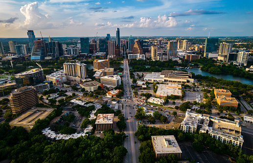 Tech boom skyscrapers with Austin Texas skyline cityscape with bridges crossing lady bird lake and gorgeous city views