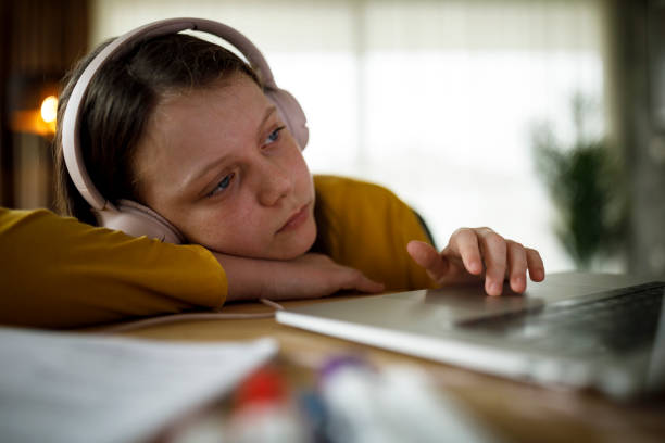 bored school girl having online class - learning boredom studying child imagens e fotografias de stock