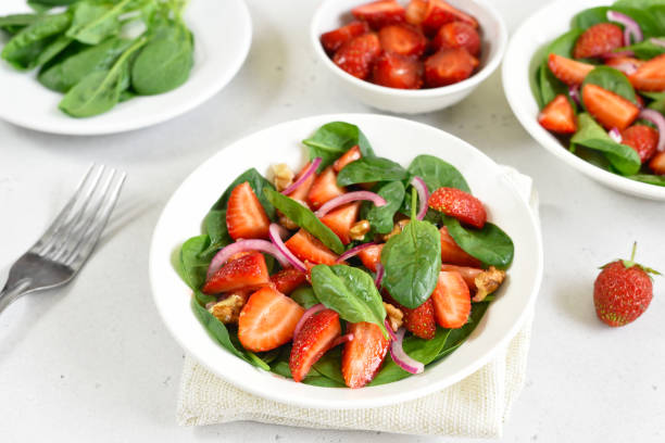 istock Healthy breakfast with fruit salad from strawberry, spinach and walnut 1323041164