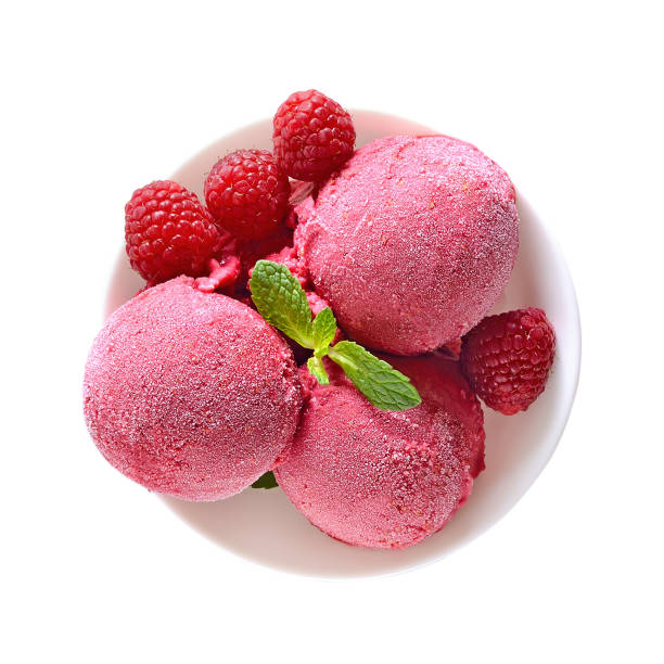 istock Raspberry ice cream scoop with fresh raspberries in bowl 1323042009