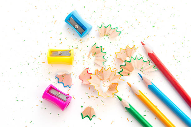 colored pencils and colored pencil sharpeners, isolated on white background.