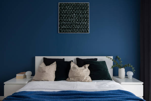 istock Navy blue wall in bedroom with double bed 1323044436