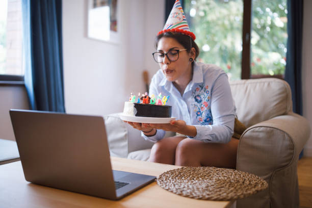 istock Woman celebrating her birthday on a video call 1323048812