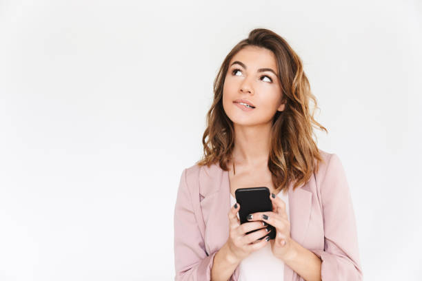 istock Young cute beautiful lady using mobile phone. 1323050248
