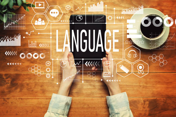 istock Language with a person holding a tablet 1323050300