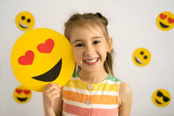istock World emoji day. Anthropomorphic smile Face 1323055523