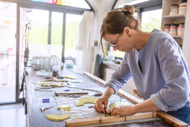 istock Glass artist craftswoman working in her studio 1323056423