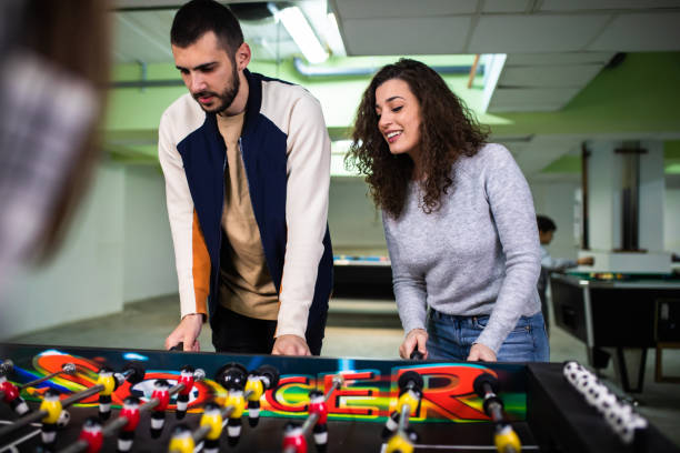 istock An attractive young couple playing table football 1323056627