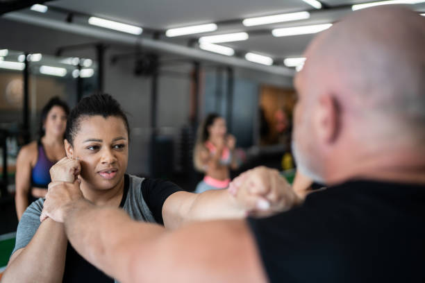 istock Intructor defending himself during boxing training at the gym 1323056630