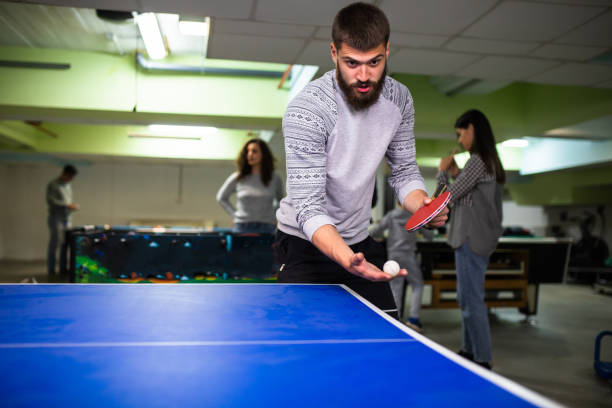 istock A young man about to serve playing table tennis 1323056657
