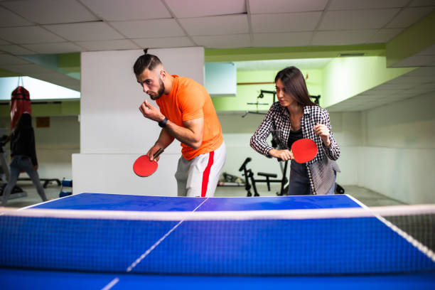 istock An active young couple is playing table tennis doubles 1323056679