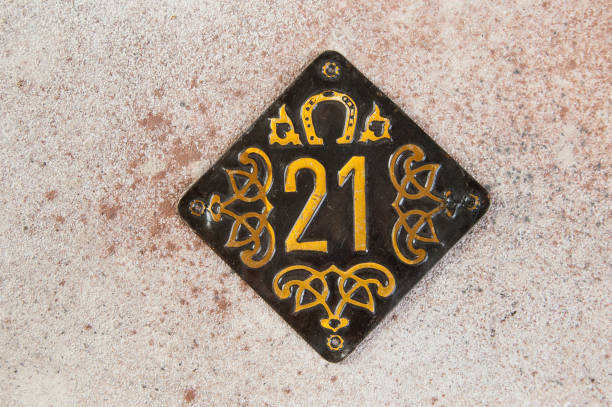 Old brass home number sign